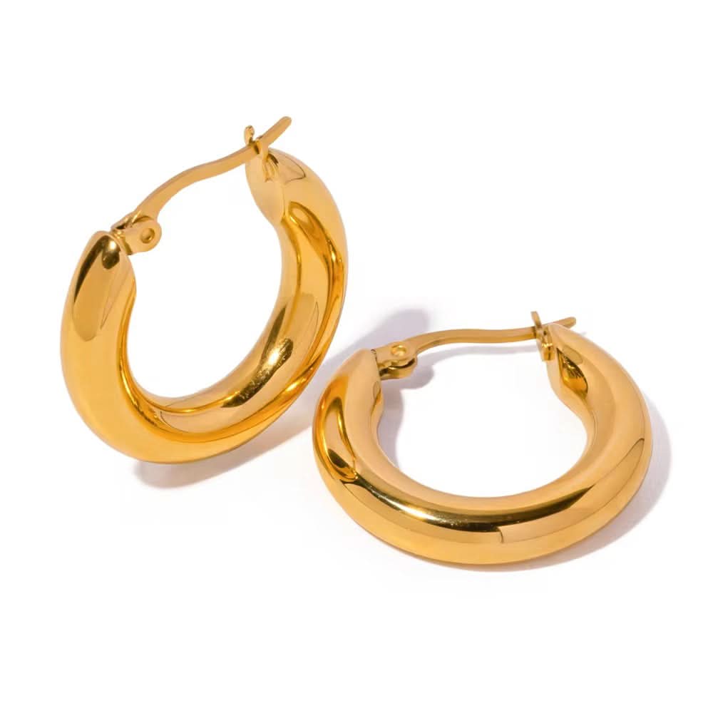Gold hoop earrings on a white background