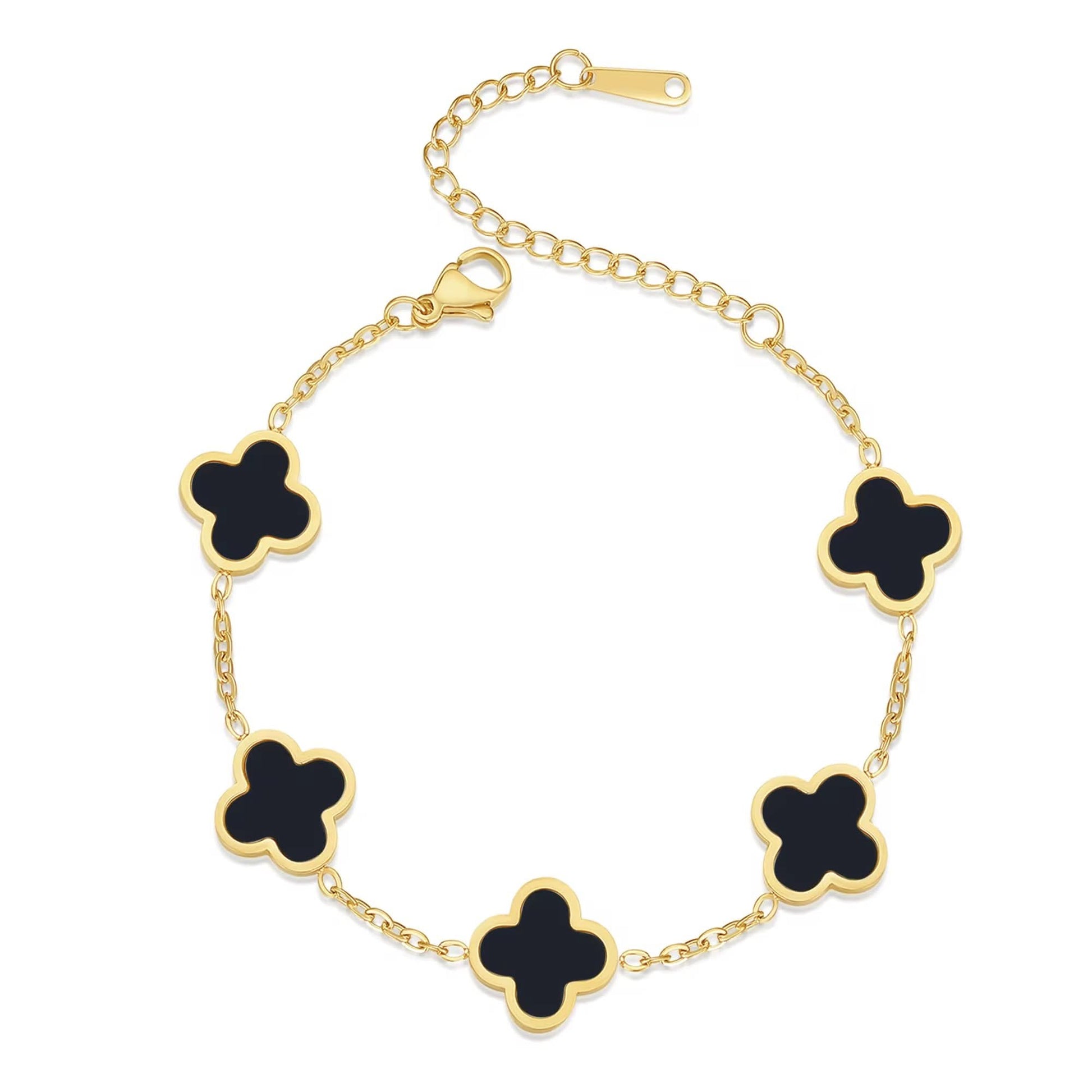 Gold bracelet with black clover-shaped charms on a white background