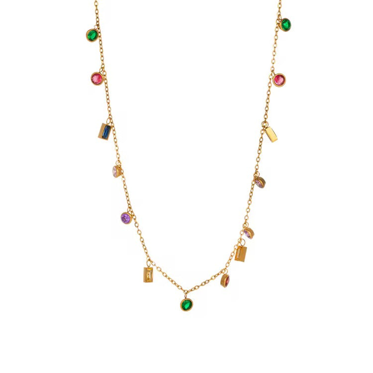 Gold necklace with colorful beads on a white background