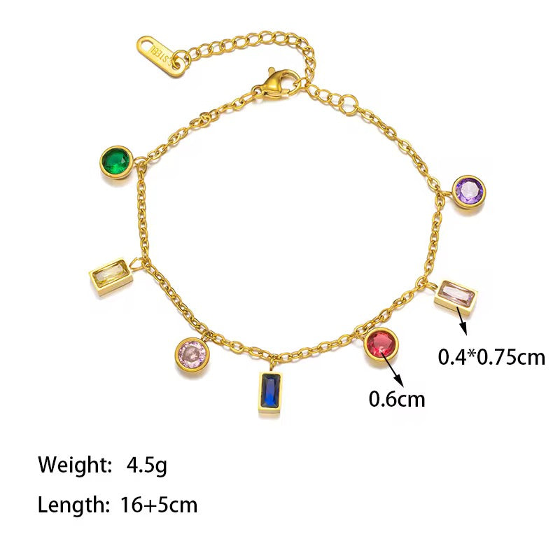 Gold bracelet with colorful gemstones and measurements on a white background