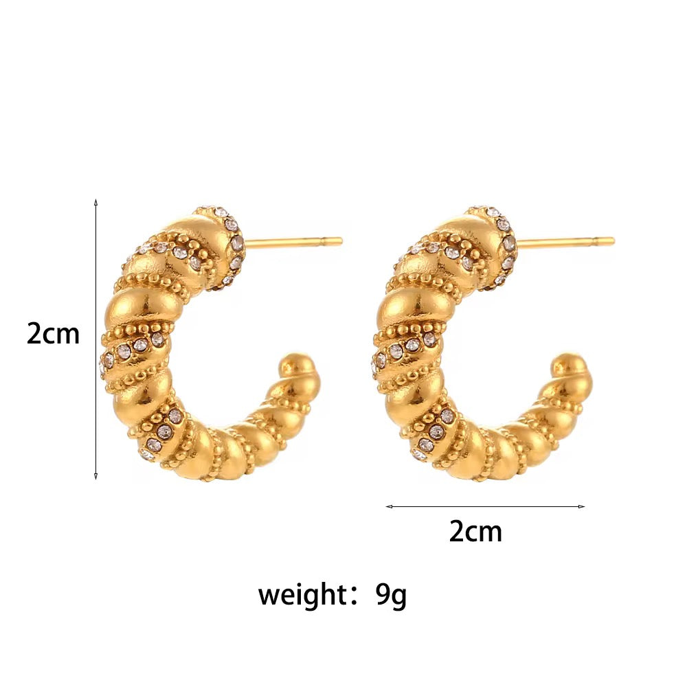 Gold hoop earrings with measurements and weight on a white background