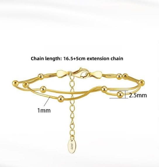 Gold anklet with measurements on a white background